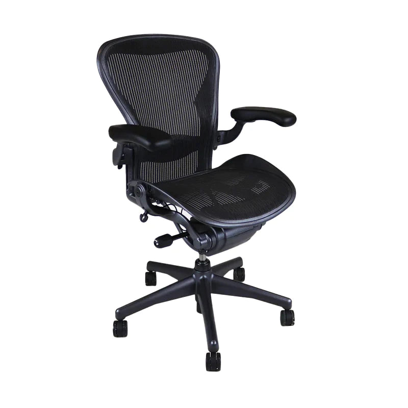 The Herman Miller Aeron, Size B, Full house has been refurbished to near factory standards. A mesh chair with every adjustment you would ever require to provide the perfect ergonomic experience. Adjustable arms, Adjustable height and Lumber and in Graphite. This is a Front side view 